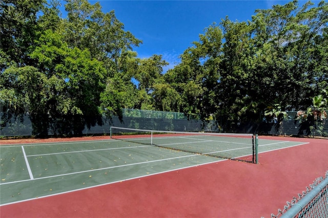 view of sport court with fence