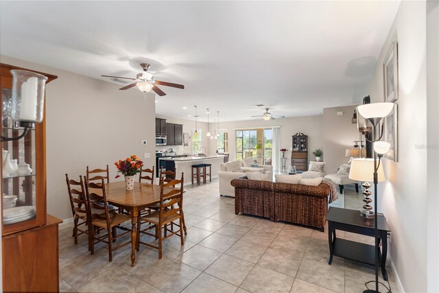 6124 35th Ct E, Bradenton, FL 34203 - dining room with light tile patterned floors and ceiling fan