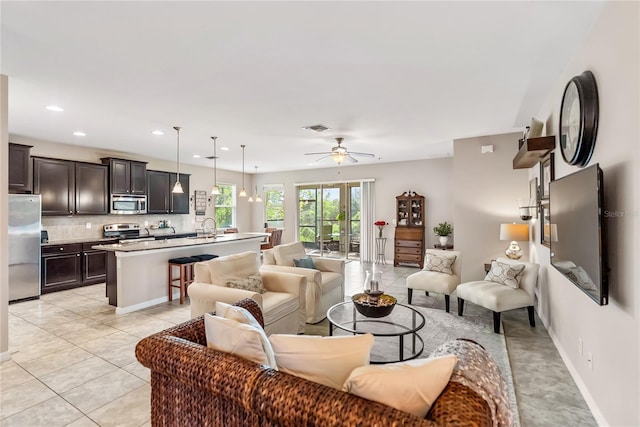 6124 35th Ct E, Bradenton, FL 34203 - living area featuring recessed lighting, light tile patterned floors, baseboards, visible vents, and a ceiling fan