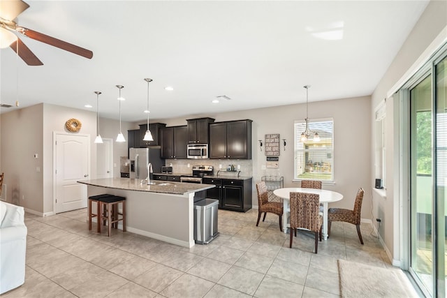 6124 35th Ct E, Bradenton, FL 34203 - kitchen featuring a healthy amount of sunlight, ceiling fan, appliances with stainless steel finishes, and a sink