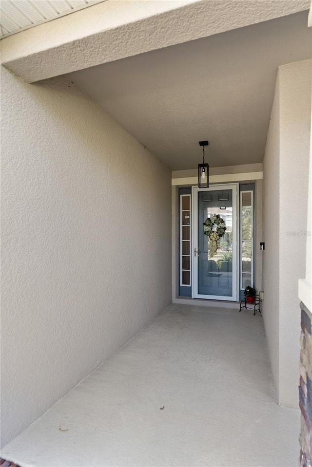 6124 35th Ct E, Bradenton, FL 34203 - doorway to property featuring stucco siding