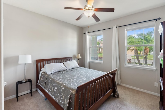6124 35th Ct E, Bradenton, FL 34203 - carpeted bedroom with baseboards and ceiling fan