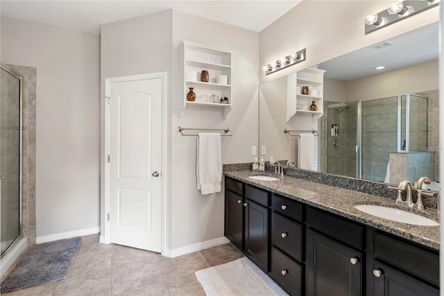 6124 35th Ct E, Bradenton, FL 34203 - bathroom featuring a stall shower, double vanity, and a sink