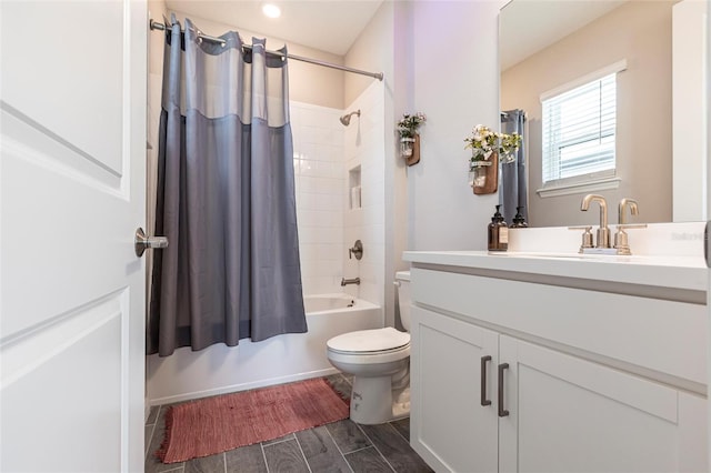 bathroom featuring shower / bath combo, vanity, and toilet