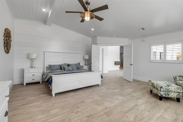 bedroom with lofted ceiling with beams, light wood-type flooring, baseboards, visible vents, and a ceiling fan