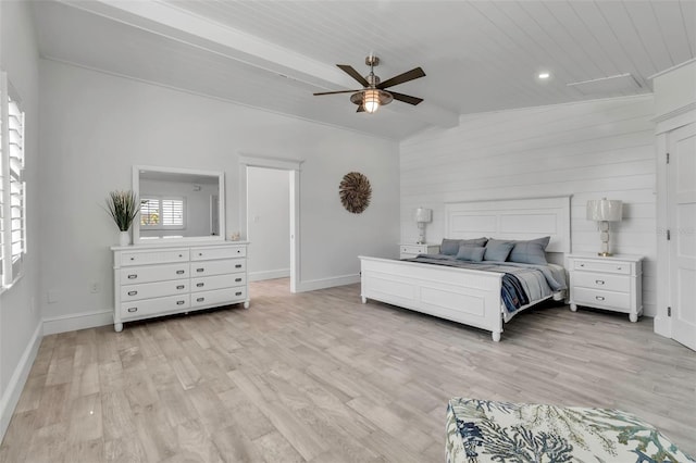 bedroom featuring baseboards, light wood finished floors, ceiling fan, and lofted ceiling