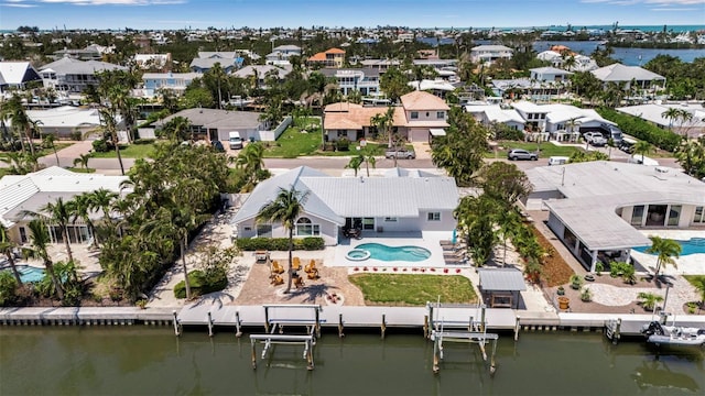 aerial view featuring a residential view and a water view