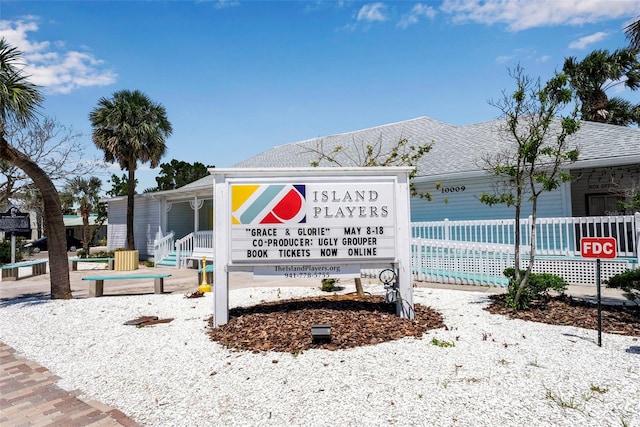 community sign featuring fence
