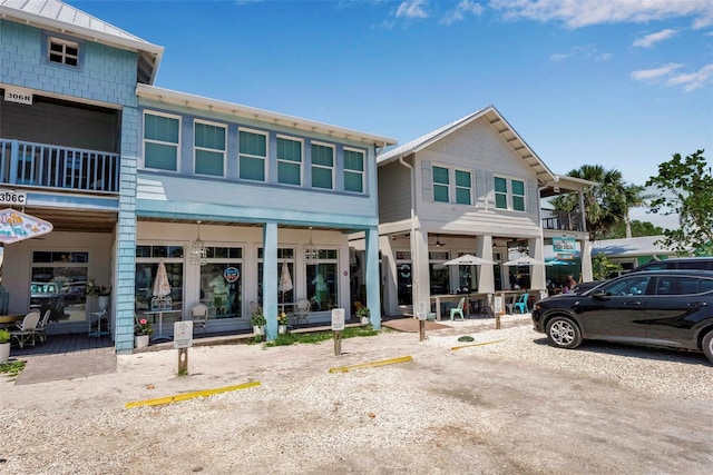 view of property featuring uncovered parking