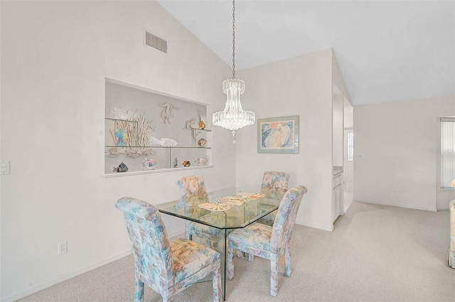4360 Presidential Avenue Cir E, Bradenton, FL 34203 - carpeted dining space with an inviting chandelier, visible vents, baseboards, and vaulted ceiling