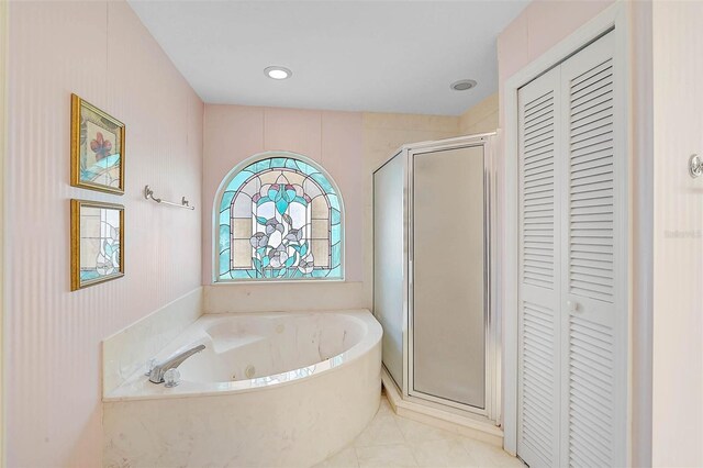 4360 Presidential Avenue Cir E, Bradenton, FL 34203 - full bath with a shower stall, tile patterned flooring, a closet, and a tub with jets