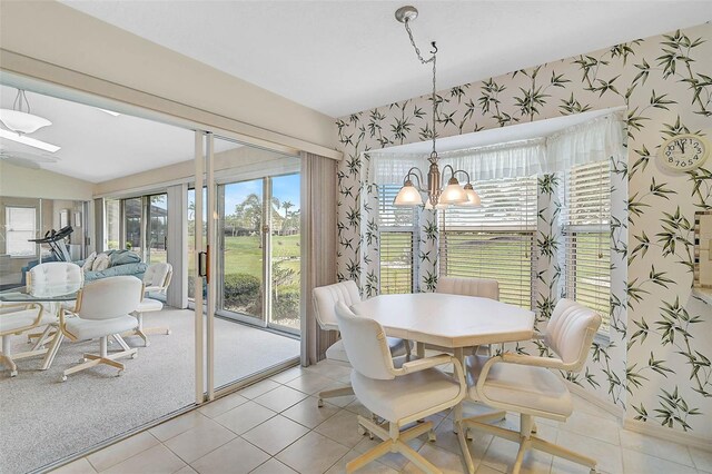 4360 Presidential Avenue Cir E, Bradenton, FL 34203 - dining room featuring wallpapered walls, light tile patterned flooring, a notable chandelier, and lofted ceiling