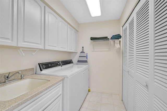 4360 Presidential Avenue Cir E, Bradenton, FL 34203 - washroom with baseboards, washing machine and dryer, light tile patterned flooring, cabinet space, and a sink
