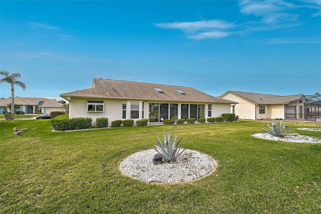 4360 Presidential Avenue Cir E, Bradenton, FL 34203 - rear view of property featuring a lawn