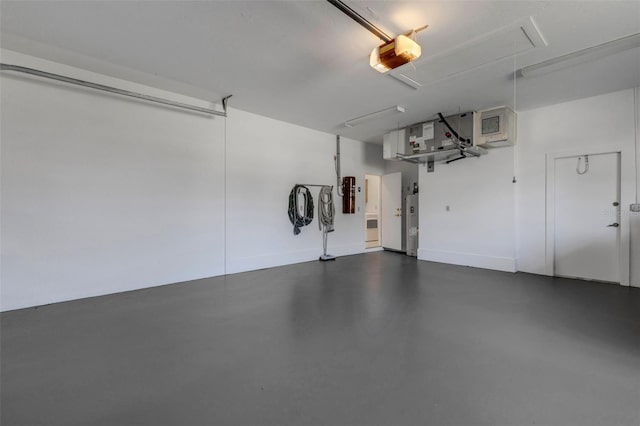 4044 Penshurst Park, Sarasota, FL 34235 - garage featuring baseboards and a garage door opener