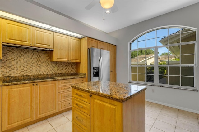4044 Penshurst Park, Sarasota, FL 34235 - kitchen featuring black electric cooktop, light tile patterned flooring, backsplash, and stainless steel fridge