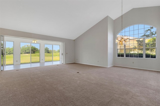4044 Penshurst Park, Sarasota, FL 34235 - unfurnished living room with high vaulted ceiling, a notable chandelier, baseboards, and carpet floors