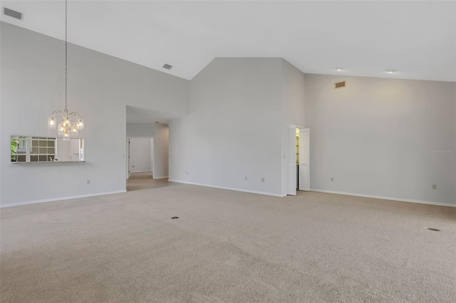 4044 Penshurst Park, Sarasota, FL 34235 - unfurnished living room with visible vents, high vaulted ceiling, a chandelier, and light carpet