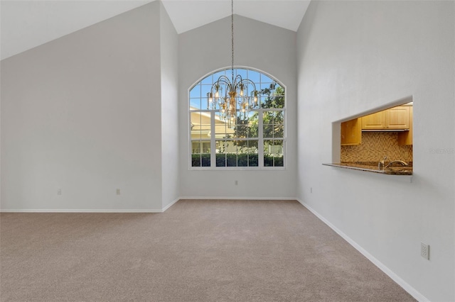 4044 Penshurst Park, Sarasota, FL 34235 - unfurnished dining area with a notable chandelier, baseboards, high vaulted ceiling, light colored carpet, and a sink