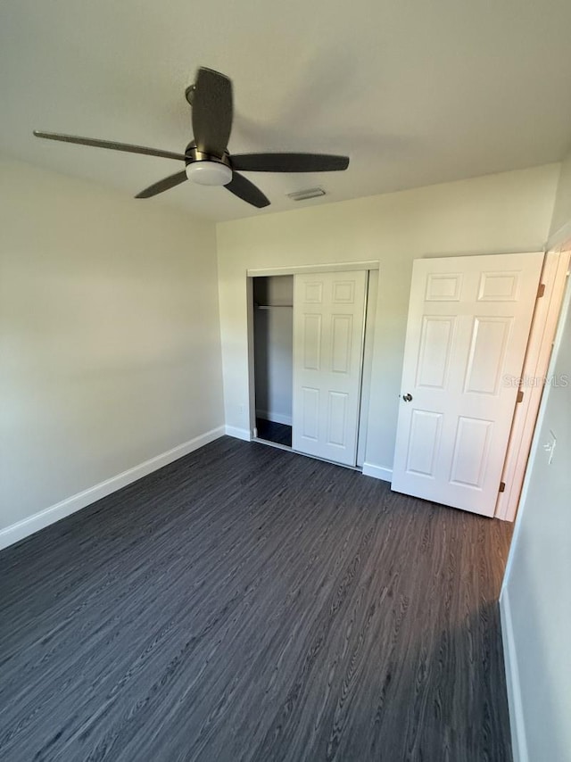 8810 N Mulberry St, Tampa, FL 33604 - unfurnished bedroom featuring visible vents, baseboards, a closet, ceiling fan, and dark wood-style floors