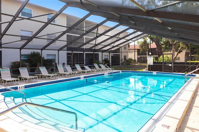 2300 Stickney Point Rd Unit 125, Sarasota, FL 34231 - community pool with glass enclosure and a patio area