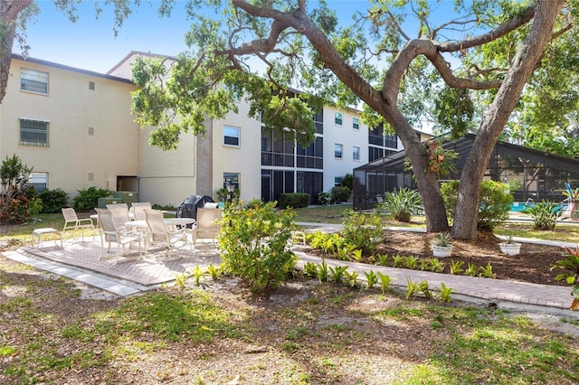 2300 Stickney Point Rd Unit 125, Sarasota, FL 34231 - rear view of property featuring a patio and stucco siding