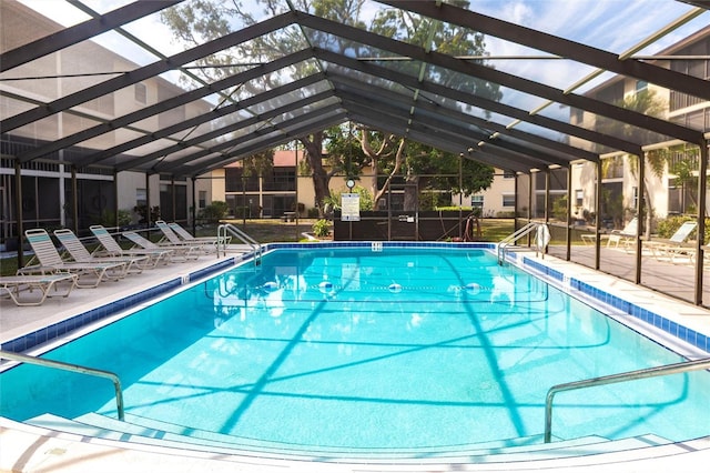 2300 Stickney Point Rd Unit 125, Sarasota, FL 34231 - community pool featuring a patio area and a lanai