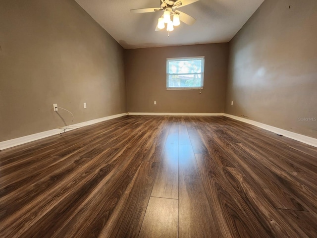 2300 Stickney Point Rd Unit 125, Sarasota, FL 34231 - empty room with a ceiling fan, dark wood-style floors, and baseboards