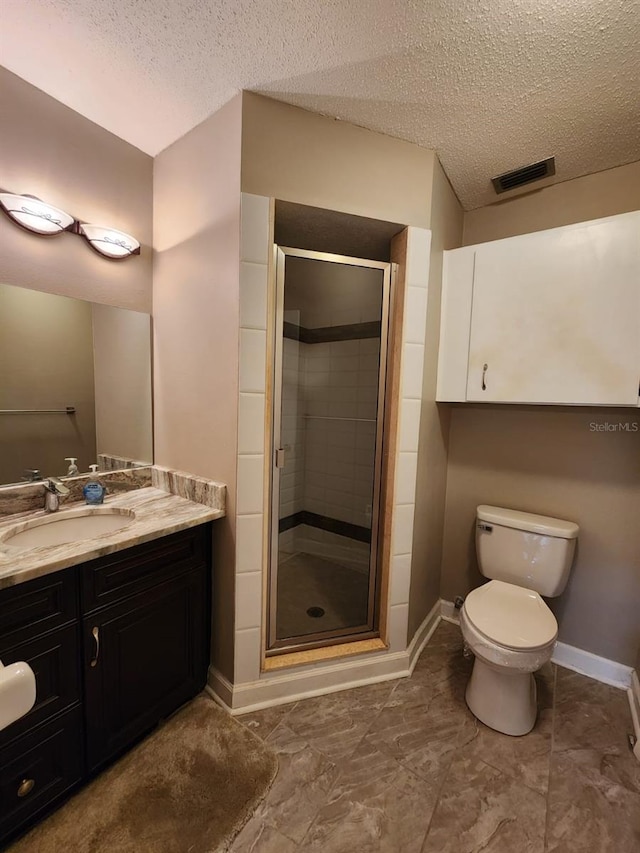 2300 Stickney Point Rd Unit 125, Sarasota, FL 34231 - full bathroom featuring baseboards, a stall shower, toilet, a textured ceiling, and vanity