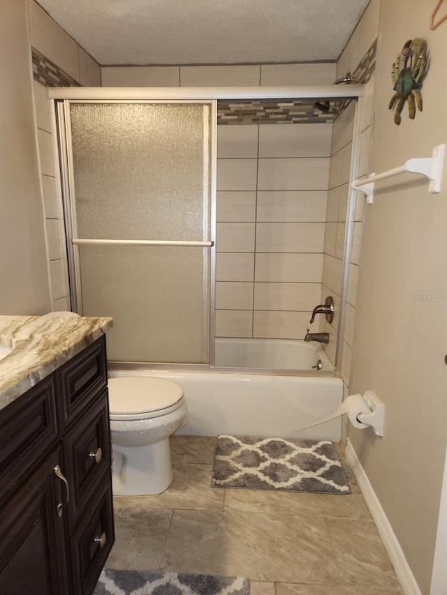 2300 Stickney Point Rd Unit 125, Sarasota, FL 34231 - full bathroom featuring bath / shower combo with glass door, vanity, toilet, and baseboards