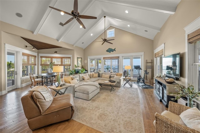 526 56th St, Holmes Beach, FL 34217 - living area featuring high vaulted ceiling, wood-type flooring, a ceiling fan, and beam ceiling
