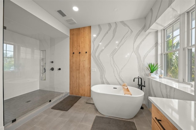 526 56th St, Holmes Beach, FL 34217 - bathroom featuring a freestanding tub, recessed lighting, visible vents, and walk in shower