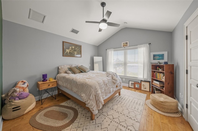 526 56th St, Holmes Beach, FL 34217 - bedroom featuring visible vents, wood finished floors, vaulted ceiling, and a ceiling fan