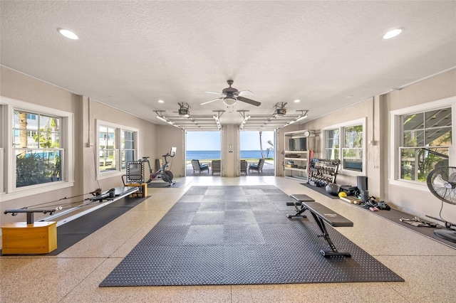 526 56th St, Holmes Beach, FL 34217 - exercise area with a textured ceiling, ceiling fan, and recessed lighting