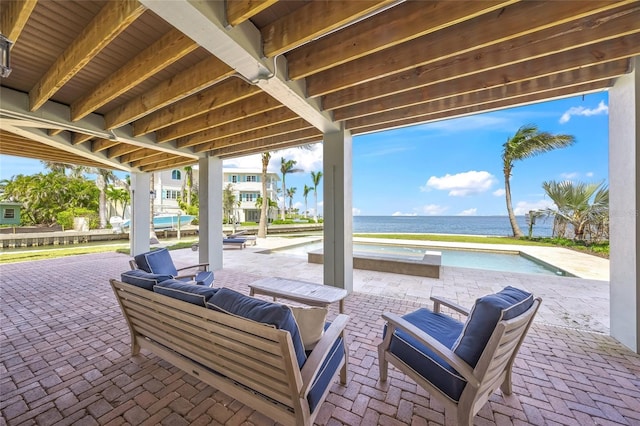 526 56th St, Holmes Beach, FL 34217 - view of patio with an outdoor hangout area and a water view