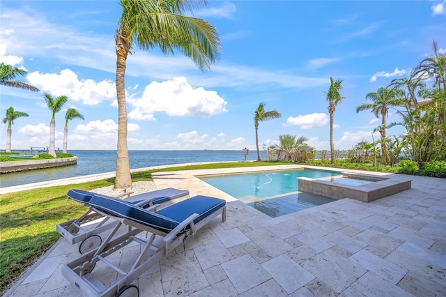 526 56th St, Holmes Beach, FL 34217 - view of swimming pool featuring a water view, a patio, and a pool with connected hot tub