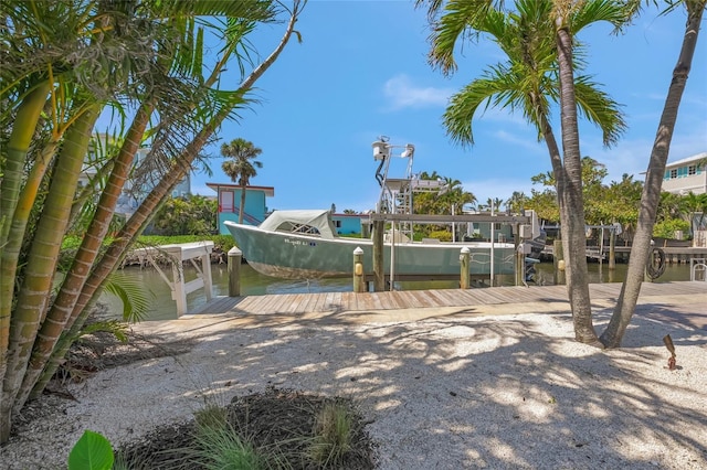 526 56th St, Holmes Beach, FL 34217 - view of property's community featuring a dock and a water view