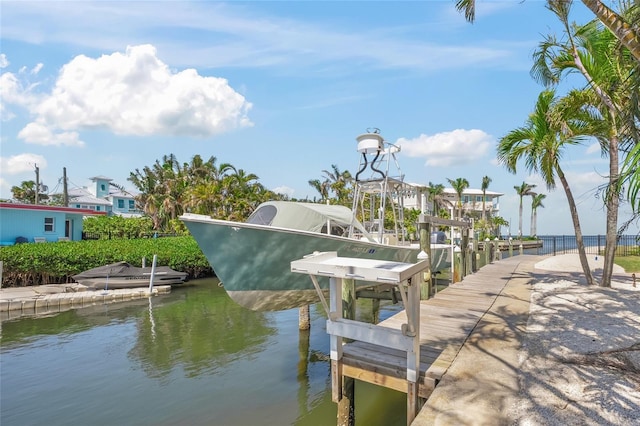 526 56th St, Holmes Beach, FL 34217 - view of dock with boat lift and a water view