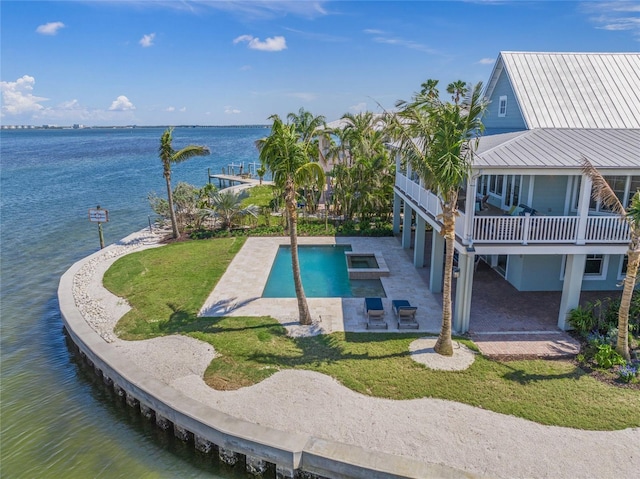 526 56th St, Holmes Beach, FL 34217 - exterior space with a patio area, a yard, and a water view