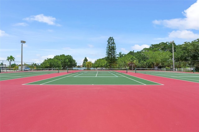 526 56th St, Holmes Beach, FL 34217 - view of tennis court featuring community basketball court and fence