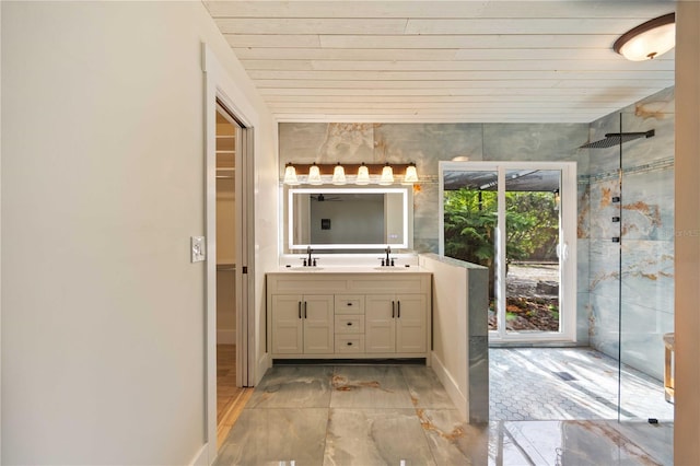 4916 Hidden Oaks Trl, Sarasota, FL 34232 - bathroom with double vanity, a shower with shower door, a walk in closet, wooden ceiling, and baseboards