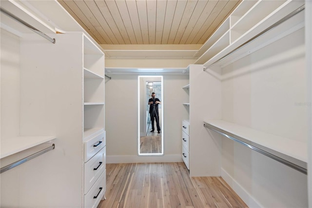 4916 Hidden Oaks Trl, Sarasota, FL 34232 - walk in closet with light wood-style flooring