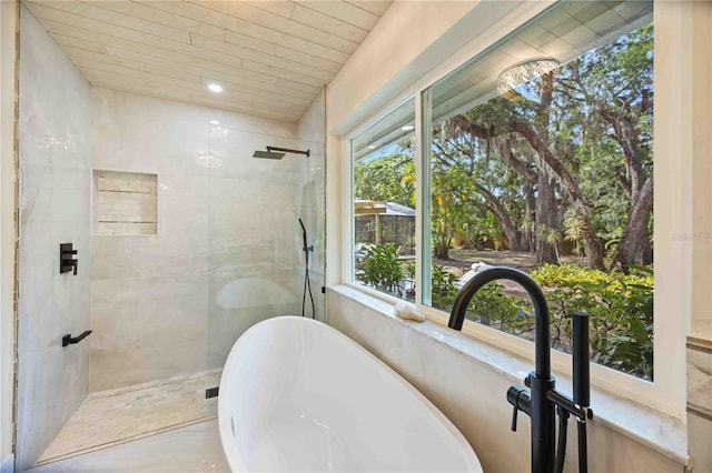 4916 Hidden Oaks Trl, Sarasota, FL 34232 - full bath with a freestanding tub, a tile shower, and wood ceiling