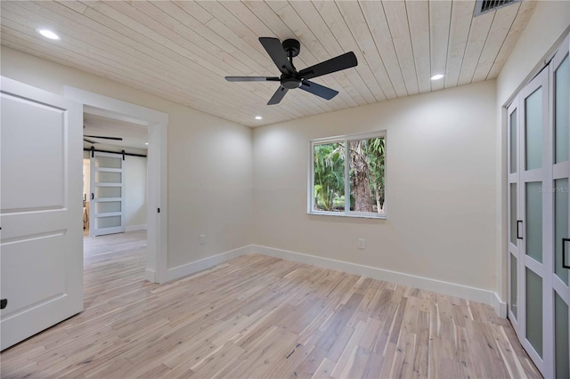 4916 Hidden Oaks Trl, Sarasota, FL 34232 - unfurnished room with a barn door, wooden ceiling, light wood finished floors, a ceiling fan, and recessed lighting