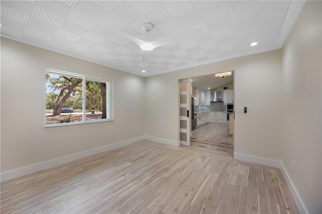 4916 Hidden Oaks Trl, Sarasota, FL 34232 - unfurnished room featuring baseboards, light wood-type flooring, recessed lighting, and crown molding