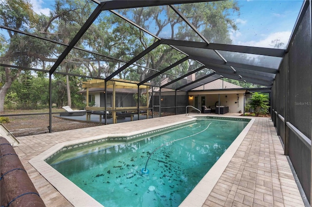 4916 Hidden Oaks Trl, Sarasota, FL 34232 - swimming pool with a patio area and glass enclosure