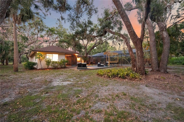 4916 Hidden Oaks Trl, Sarasota, FL 34232 - view of yard featuring a lanai and a patio