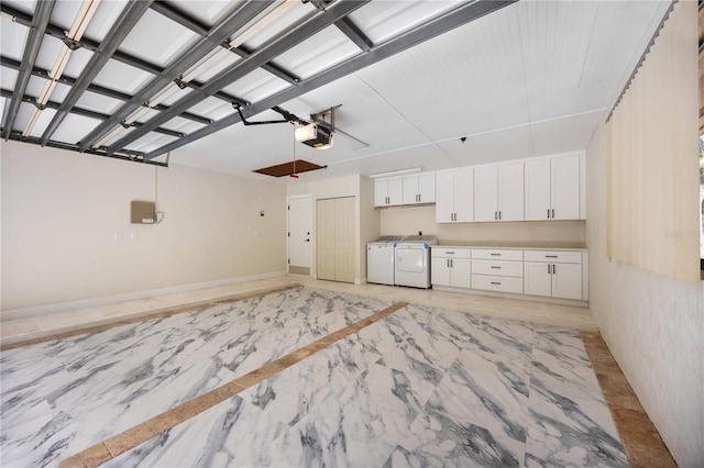 4916 Hidden Oaks Trl, Sarasota, FL 34232 - garage featuring washing machine and clothes dryer and a garage door opener