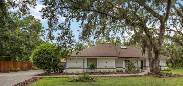 4916 Hidden Oaks Trl, Sarasota, FL 34232 - view of front of property with stucco siding, a shingled roof, and driveway