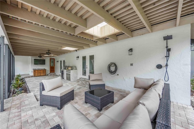 4916 Hidden Oaks Trl, Sarasota, FL 34232 - view of patio / terrace with an outdoor hangout area, french doors, an outdoor kitchen, and a ceiling fan